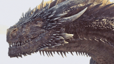A Close Up Of A Dragon 'S Face With Sharp Teeth GIF