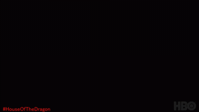 A Close Up Of A Dragon 'S Face With The Hashtag #House Of The Dragon GIF
