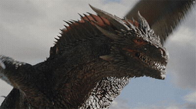A Close Up Of A Dragon 'S Head Against A Blue Sky GIF