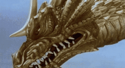 A Close Up Of A Dragon 'S Head With A Blue Sky In The Background GIF