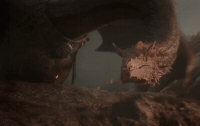 A Close Up Of A Dragon 'S Head With A Very Long Neck GIF