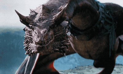 A Close Up Of A Dragon 'S Head With Horns And Wings GIF