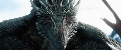 A Close Up Of A Dragon 'S Head With Sharp Teeth GIF