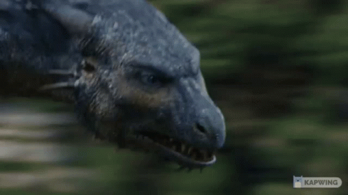 A Close Up Of A Dragon 'S Mouth With The Word Kapwing On The Bottom GIF