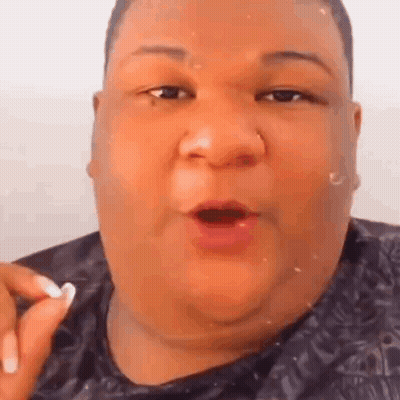 A Close Up Of A Fat Man 'S Face With His Mouth Open And A Nose Ring . GIF
