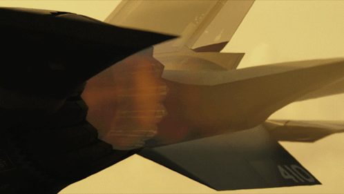 A Close Up Of A Fighter Jet With The Number 400 On The Tail GIF