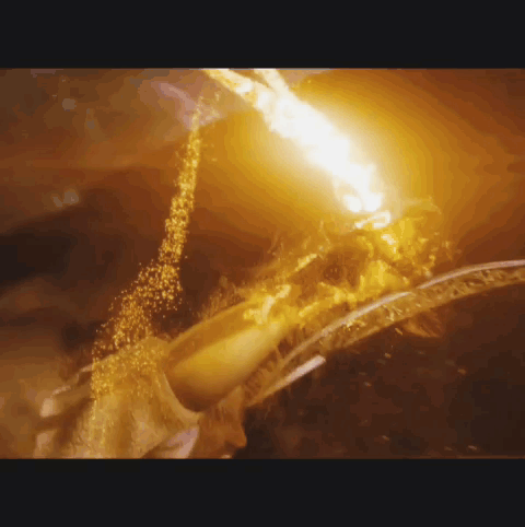 A Close Up Of A Fire Coming Out Of A Hole GIF