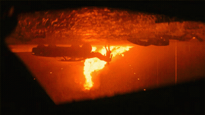 A Close Up Of A Fire Coming Out Of A Hole GIF