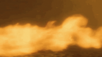 A Close Up Of A Fire With Smoke Coming Out Of It Against A Dark Background . GIF