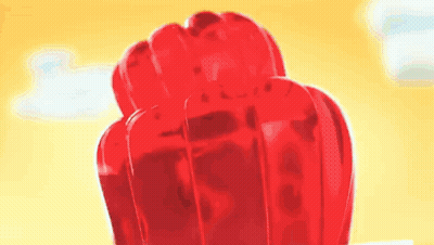 A Close Up Of A Fist Made Out Of Jelly On A Yellow Background . GIF