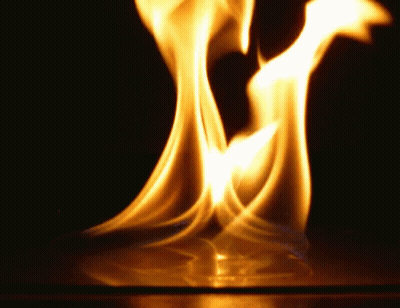 A Close Up Of A Flame On A Black Background GIF