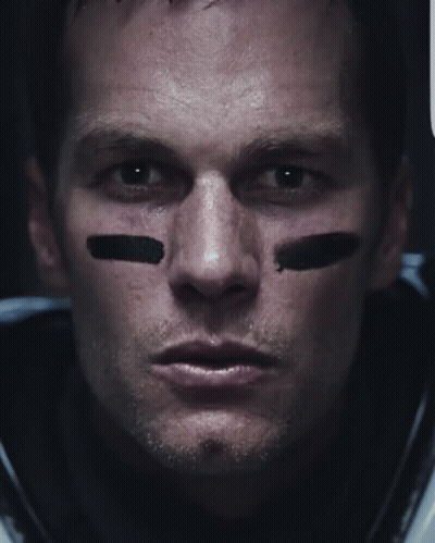 A Close Up Of A Football Player 'S Face With Black Stripes On His Face GIF