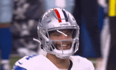 A Close Up Of A Football Player Wearing A Helmet And Smiling GIF
