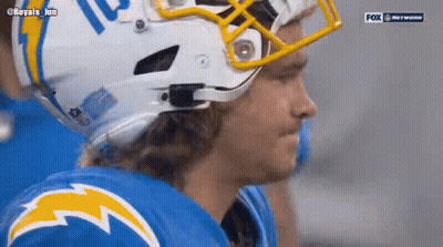 A Close Up Of A Football Player Wearing A Helmet GIF