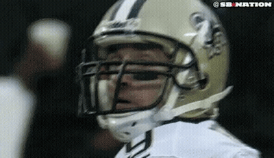 A Close Up Of A Football Player Wearing A Helmet That Says Sb Nation On It GIF