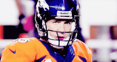 A Close Up Of A Football Player Wearing A Riddell Helmet GIF