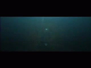A Close Up Of A Foreign Language Written On A Black Surface GIF