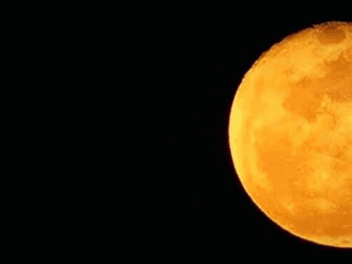 A Close Up Of A Full Moon In The Night Sky . GIF