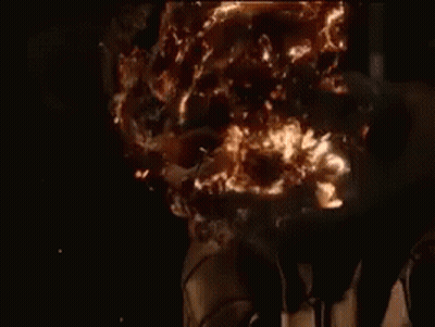 A Close Up Of A Ghost Rider 'S Head With Fire Coming Out Of It . GIF
