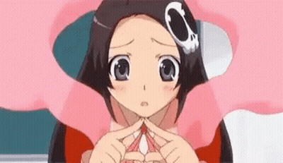 A Close Up Of A Girl Making A Heart With Her Hands . GIF