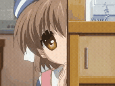 A Close Up Of A Girl Peeking Out From Behind A Dresser . GIF