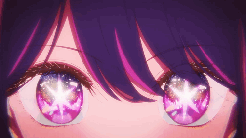 A Close Up Of A Girl 'S Eyes With Purple And Pink Highlights GIF