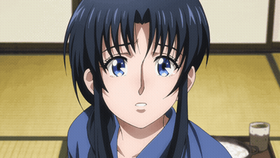 A Close Up Of A Girl 'S Face With A Blue Shirt On GIF