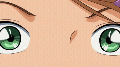 A Close Up Of A Girl 'S Face With A Flower In Her Hair GIF
