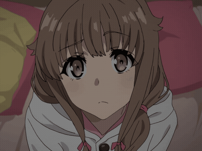 a close up of a girl 's face with a pink bow in her hair