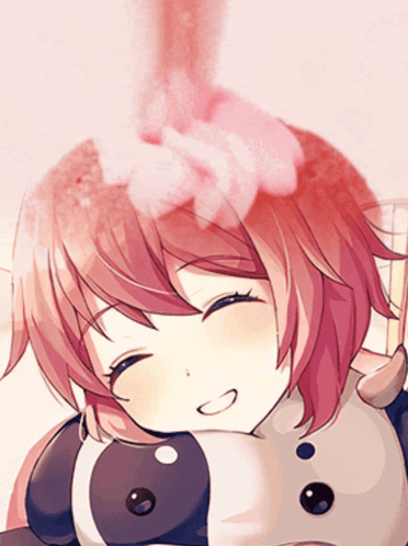 A Close Up Of A Girl 'S Face With A Pink Flower In Her Hair GIF