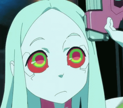 A Close Up Of A Girl 'S Face With A Pink Object In The Background GIF