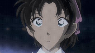 A Close Up Of A Girl 'S Face With A Pink Ribbon In Her Hair GIF