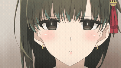 A Close Up Of A Girl 'S Face With A Red Bow On Her Head GIF