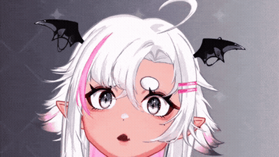A Close Up Of A Girl 'S Face With Bat Wings On Her Ears GIF