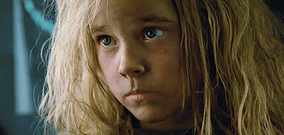 A Close Up Of A Girl 'S Face With Blonde Hair GIF