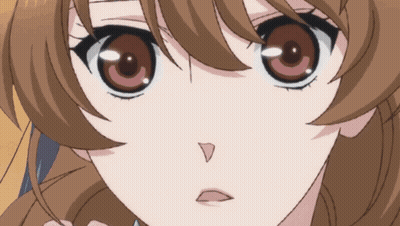 A Close Up Of A Girl 'S Face With Brown Hair GIF