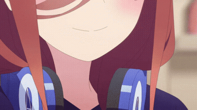 A Close Up Of A Girl 'S Face With Headphones On GIF