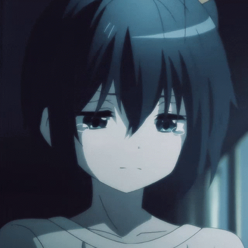 A Close Up Of A Girl 'S Face With Her Eyes Closed GIF