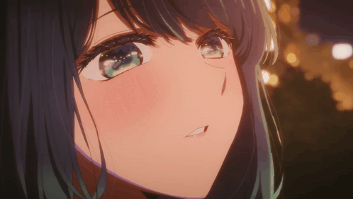 A Close Up Of A Girl 'S Face With Her Mouth Open GIF
