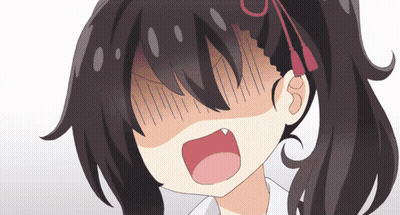 A Close Up Of A Girl 'S Face With Her Mouth Wide Open GIF