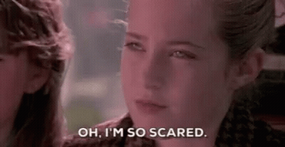 A Close Up Of A Girl 'S Face With The Words `` Oh , I 'M So Scared '' Written On It . GIF