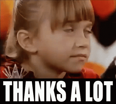 a close up of a girl 's face with the words `` thanks a lot '' written above her .
