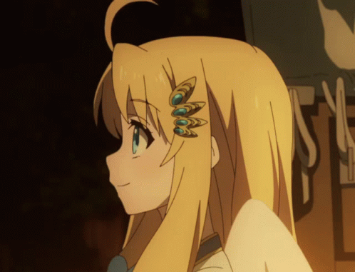 A Close Up Of A Girl 'S Head With A Few Feathers On Her Hair GIF