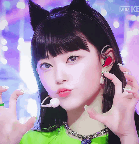 A Close Up Of A Girl Wearing A Headband With Cat Ears And Headphones GIF