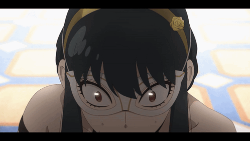 A Close Up Of A Girl Wearing Glasses And A Headband With A Flower On It GIF