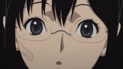 A Close Up Of A Girl Wearing Glasses Looking At The Camera GIF