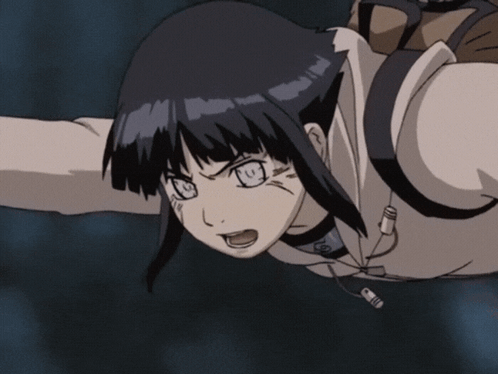 A Close Up Of A Girl With A Yellow Circle With A Flame On It GIF