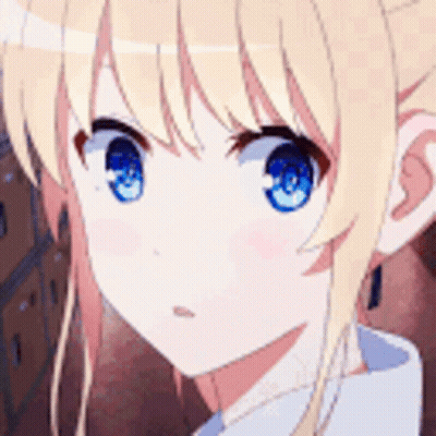A Close Up Of A Girl With Blonde Hair And Blue Eyes . GIF