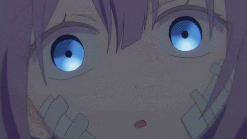 A Close Up Of A Girl With Blue Eyes GIF
