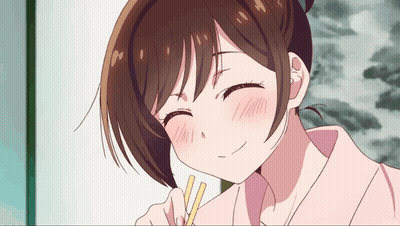 A Close Up Of A Girl With Chopsticks In Her Hand GIF